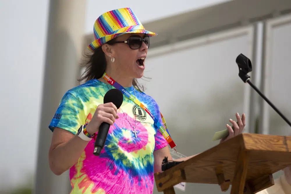 Jessica speaking at a community Pride event
